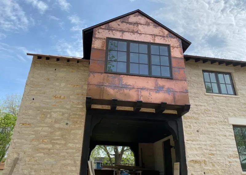 Copper metal panel facade on a stone building for Metal Roof Coating in Lakeland